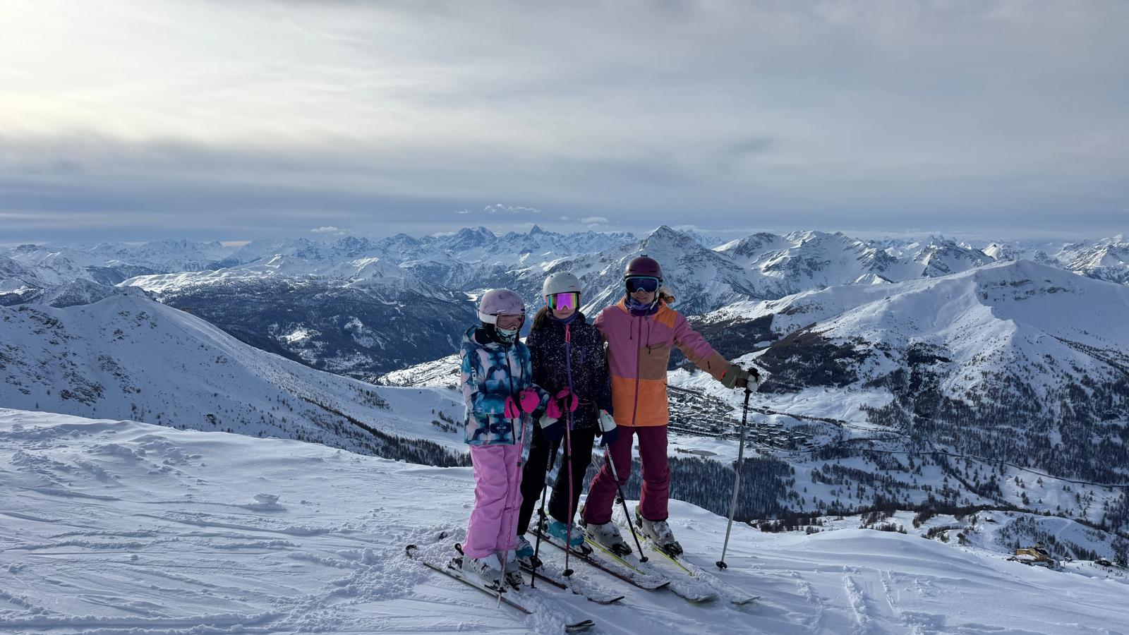 Csilla with young skiers in the snow-covered mountains